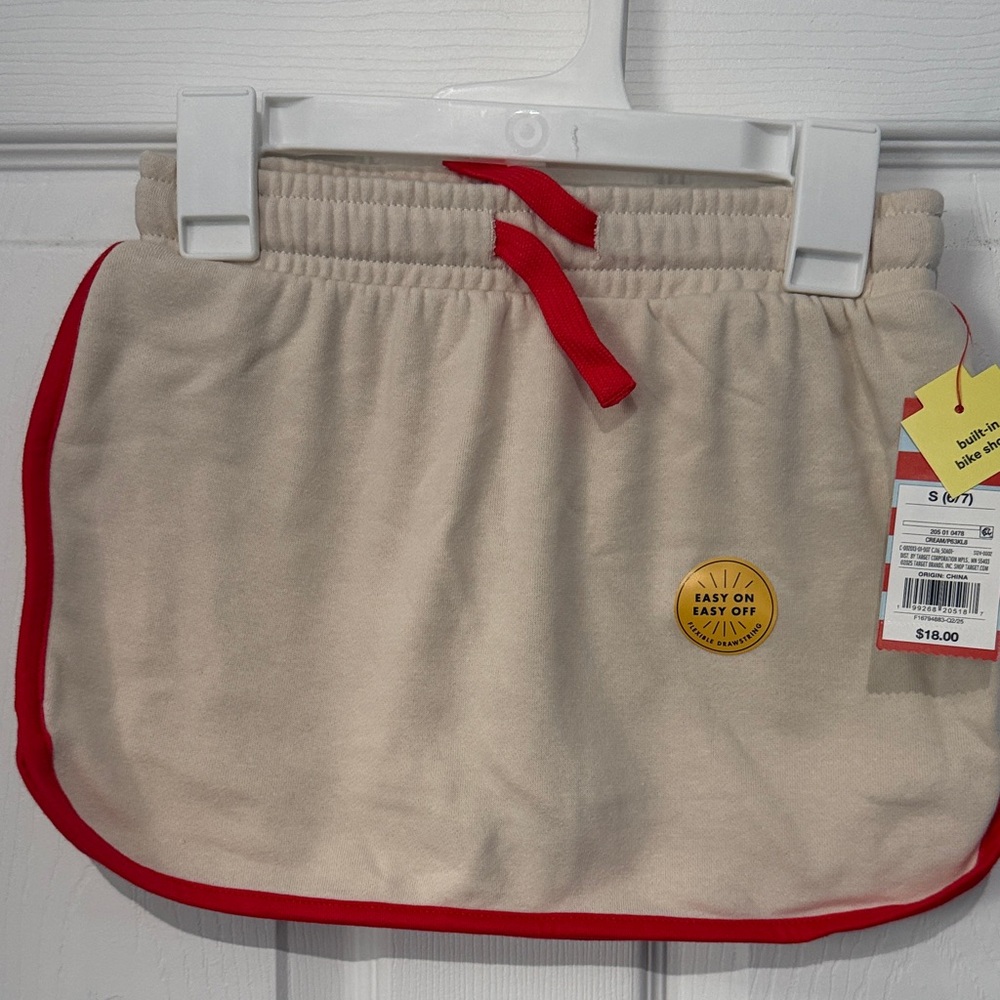 NWT Kids Cat & Jack Beige Skort with biker shorts and Red Trim. Size Small.